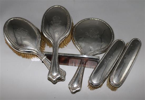 A silver mounted six piece brush set.